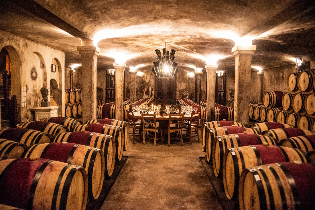 A candlelit tasting table among the barrels in the Hamilton Russell cellar